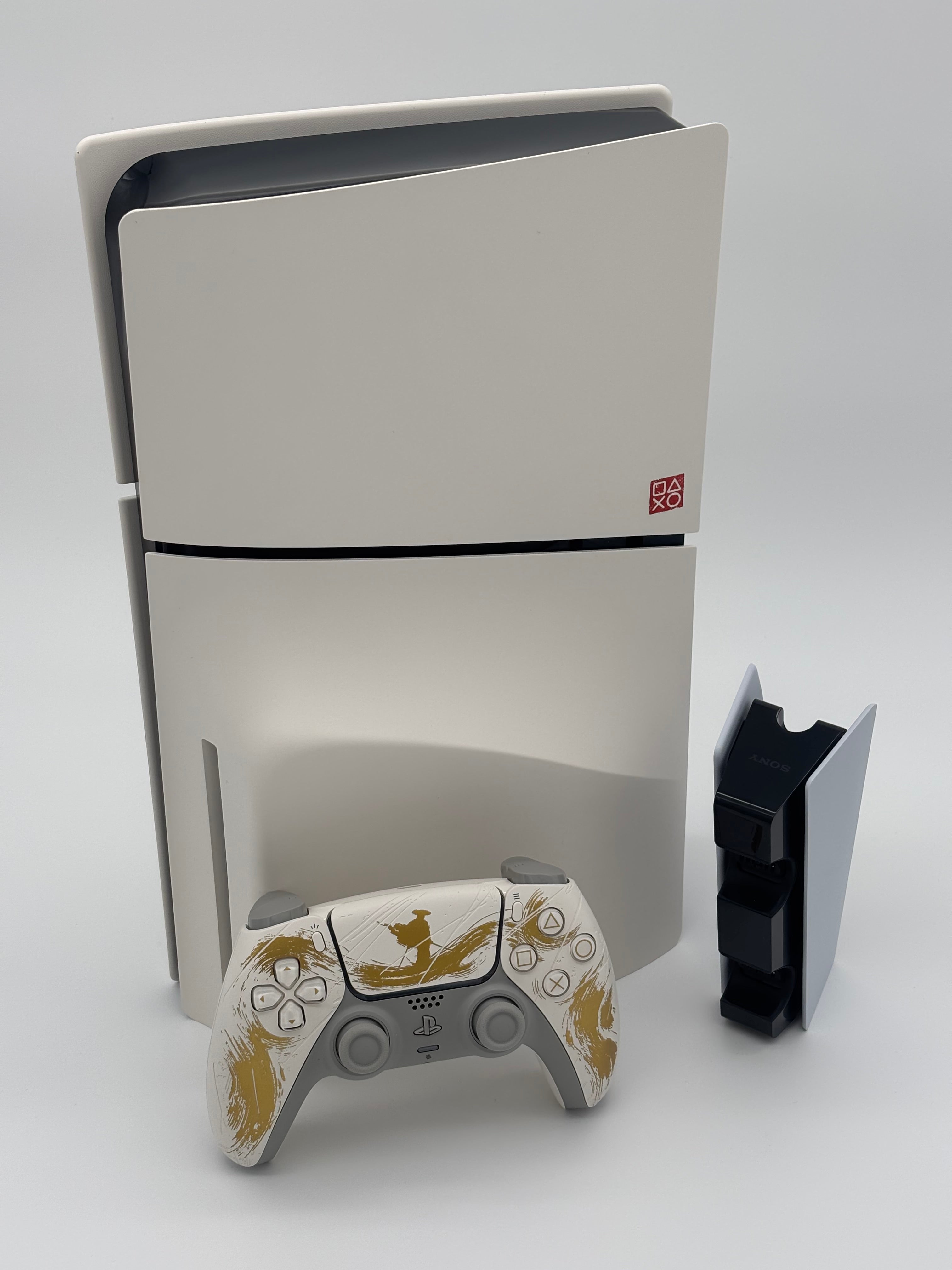 Mobile2fix PlayStation 5 Ghost of Yotei special edition console and themed DualSense controller on white background