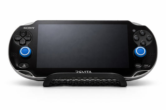 Mobile2fix black Sony PlayStation PS Vita handheld console with blue analog stick caps on a display stand