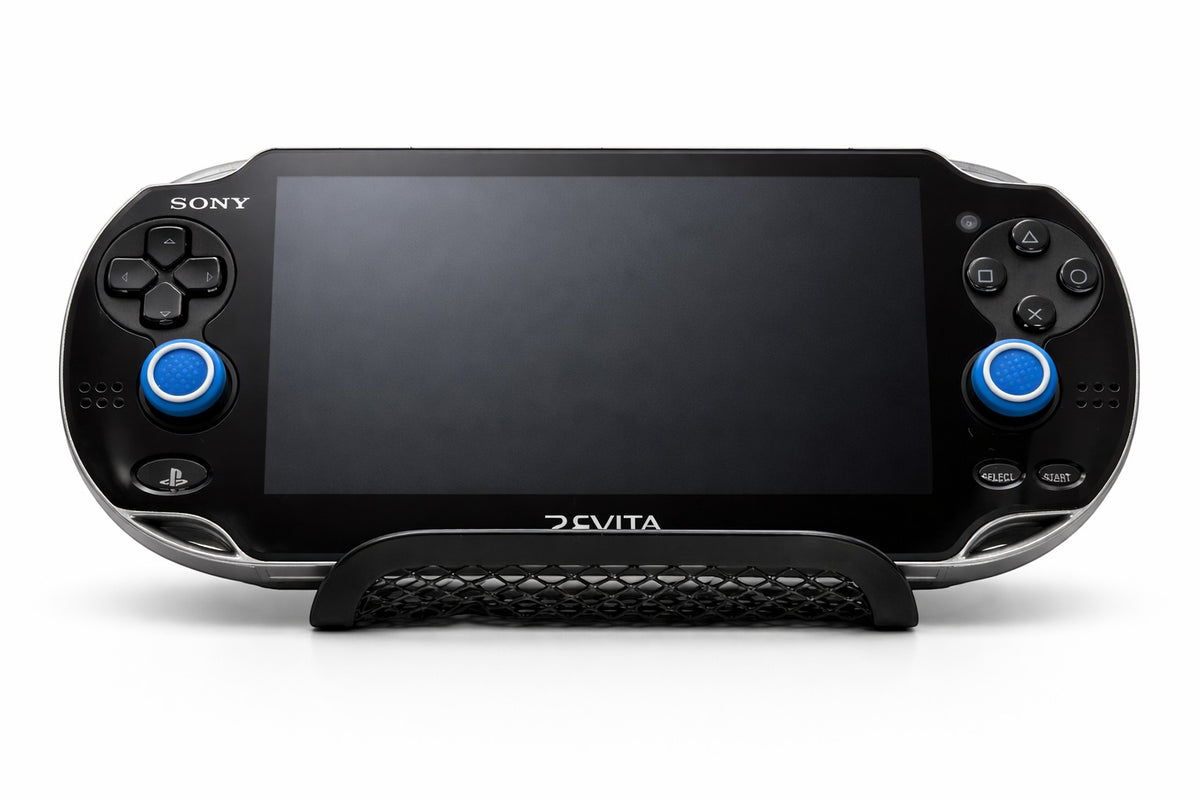 Mobile2fix black Sony PlayStation PS Vita handheld console with blue analog stick caps on a display stand