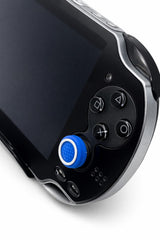 Mobile2fix black Sony PlayStation PS Vita handheld console with a blue analog stick cover, close-up view.