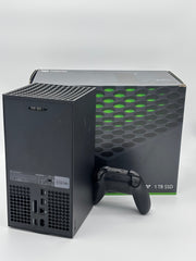Mobile2fix pre-owned black XBOX Series X console and controller with original box, showing minor outer case wear.