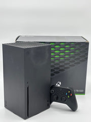 Mobile2fix pre-owned black Xbox Series X console with controller and original retail box on a white background