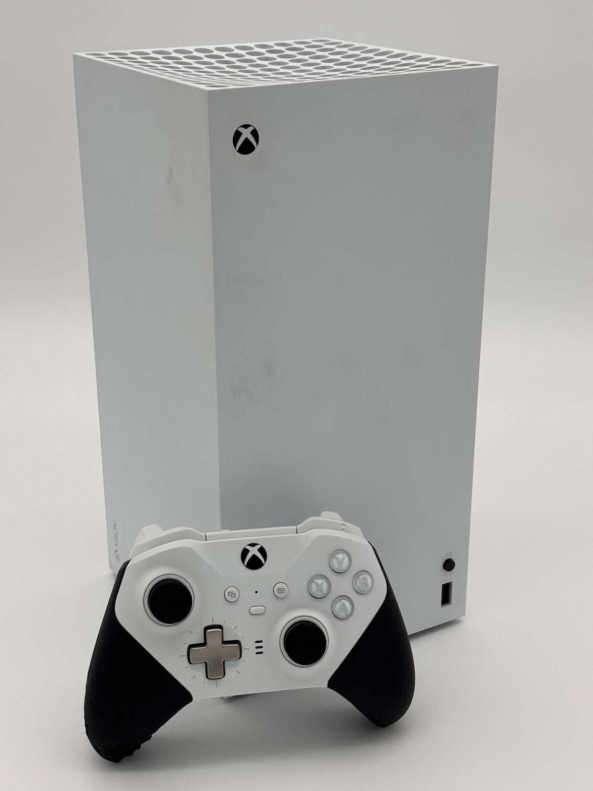 Mobile2fix white Xbox Series X digital console and Elite Series 2 controller bundle with visible wear on grip